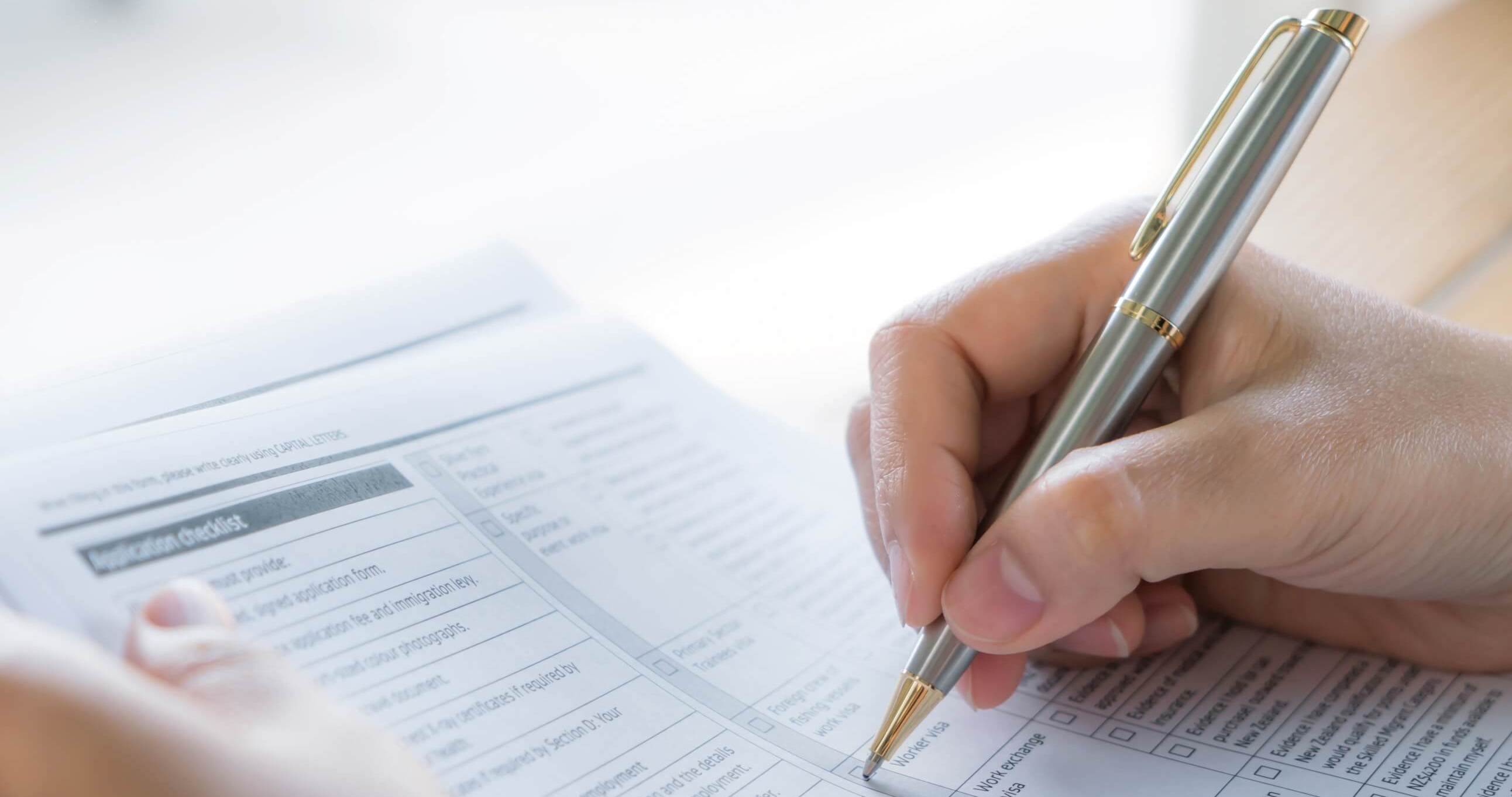 Hand With Pen Application Form
